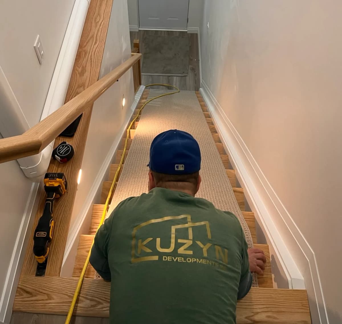 Kuzyn team member walking down stairs on project site