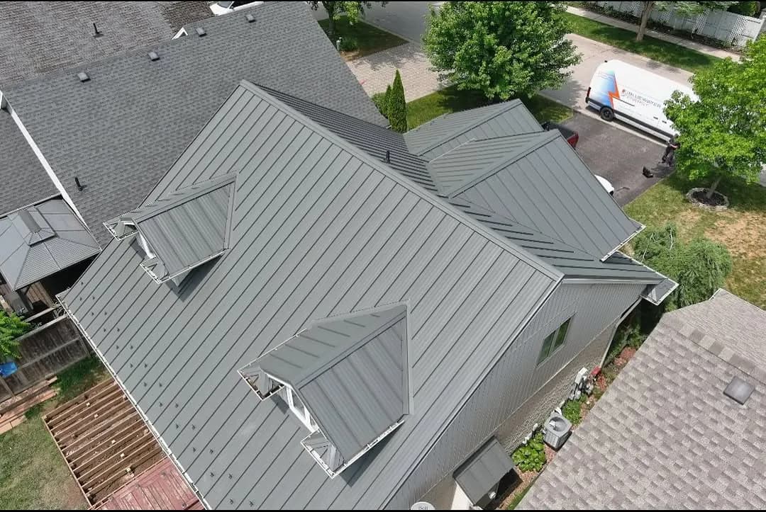 Complete residential roof replacement with gray architectural shingles, including proper ventilation and weatherproofing.